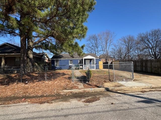 1448 Valse Road Memphis, TN 38106 - Photo 3 of 4 a front view of a house with a yard covered with snow
