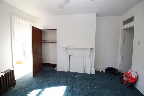 a room with closet and a window