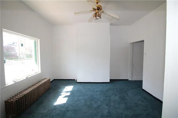a view of empty room with windows