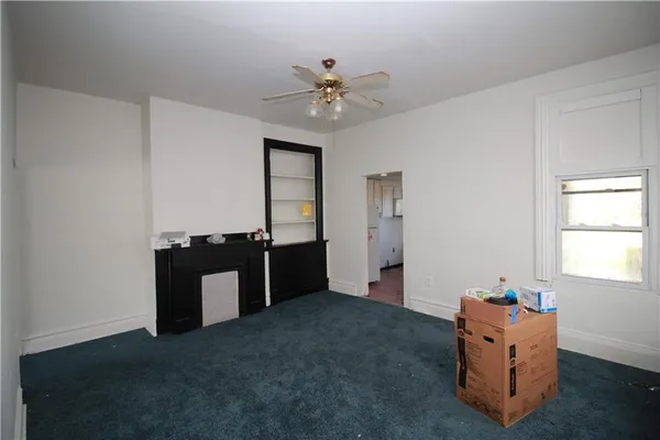 a room with window and ceiling fan