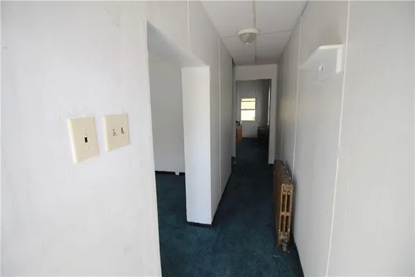 a view of a hallway with windows