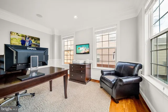 a living room with furniture fireplace and window
