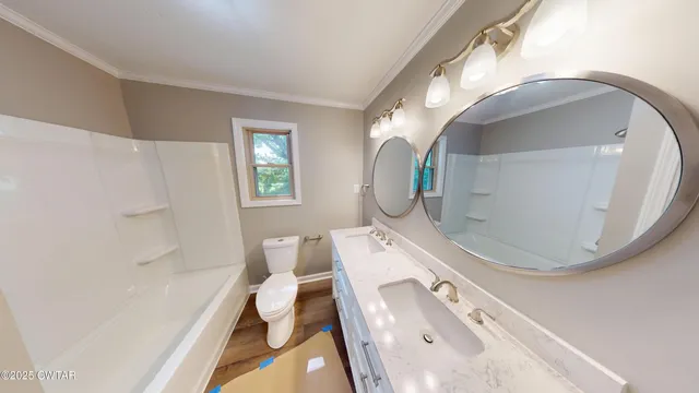 a bathroom with mirror and sink