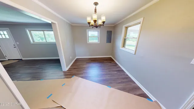 wooden floor in an empty room with window and wooden floor