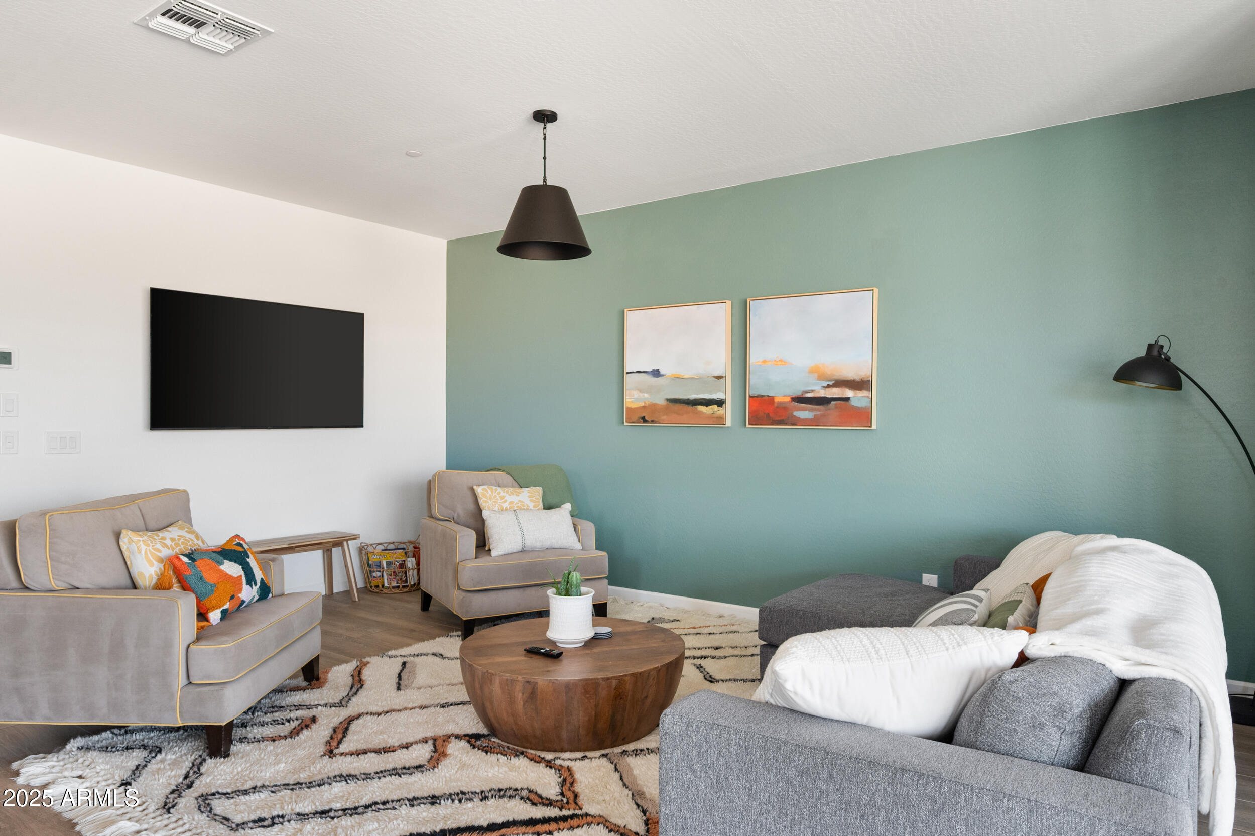 18328 East Spring Valley Court Rio Verde, AZ 85263 - Photo 11 of 39 a living room with furniture and a flat screen tv
