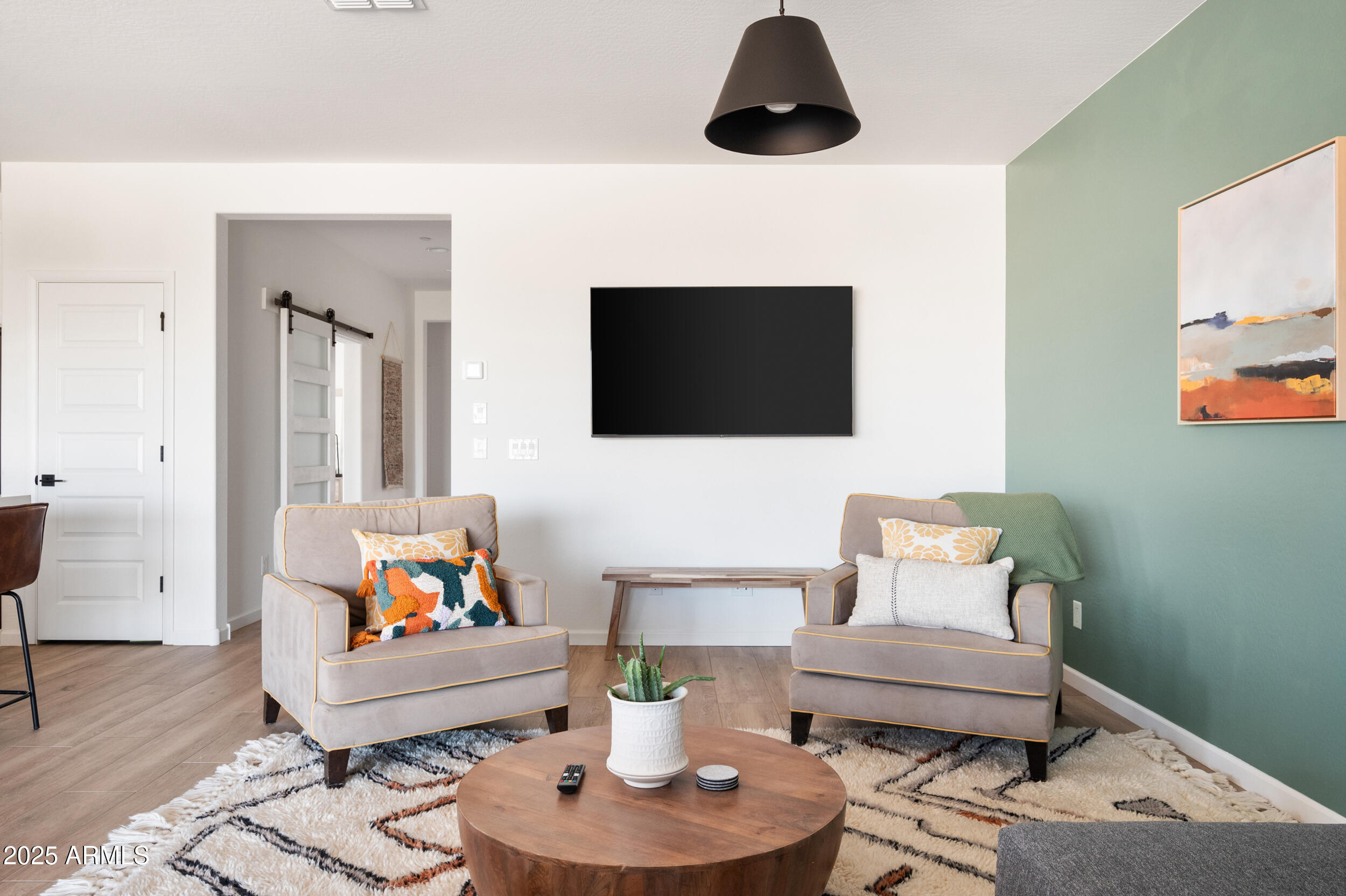 18328 East Spring Valley Court Rio Verde, AZ 85263 - Photo 12 of 39 a living room with furniture and a flat screen tv