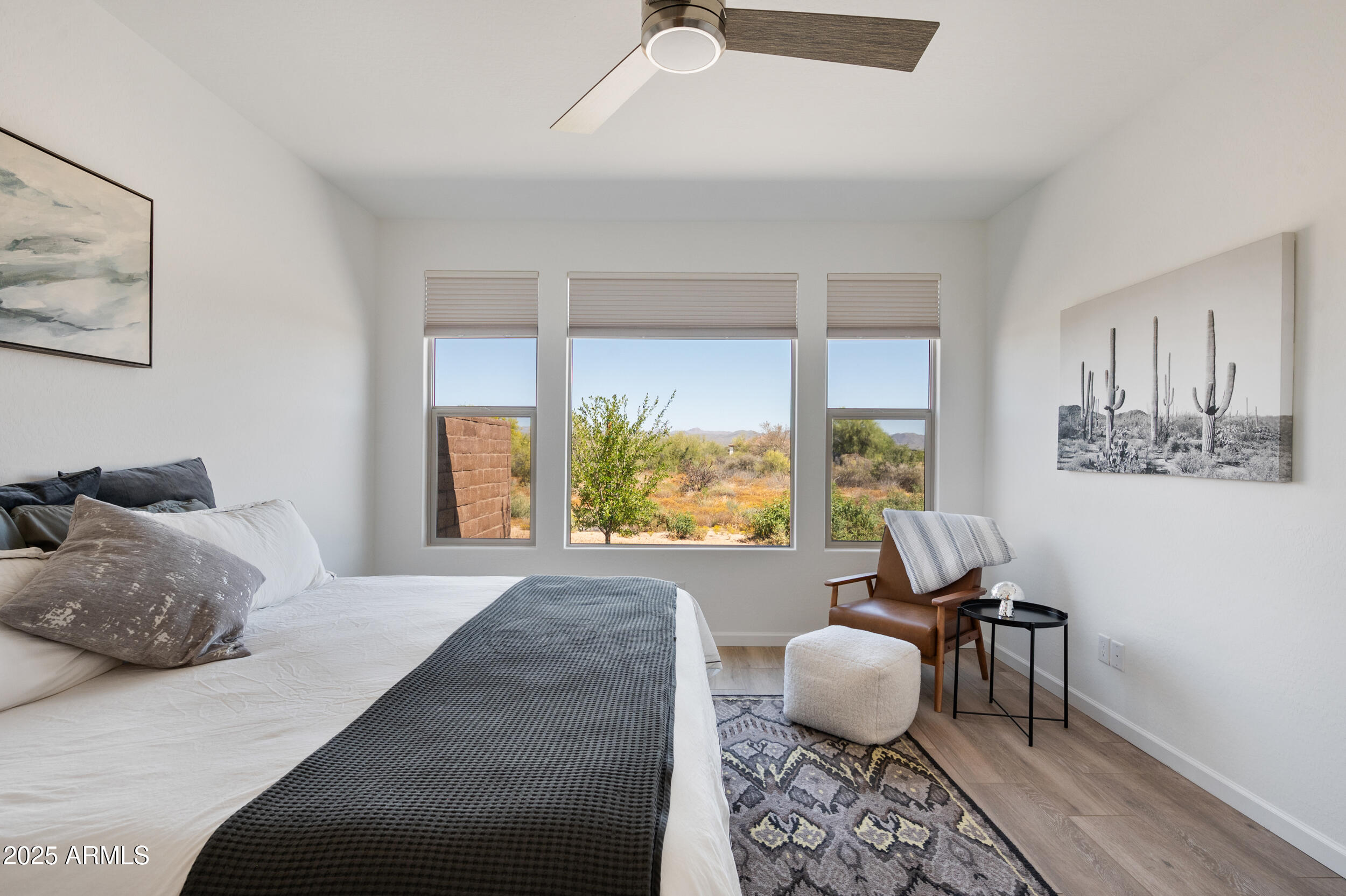 18328 East Spring Valley Court Rio Verde, AZ 85263 - Photo 14 of 39 a bedroom with furniture and a large window
