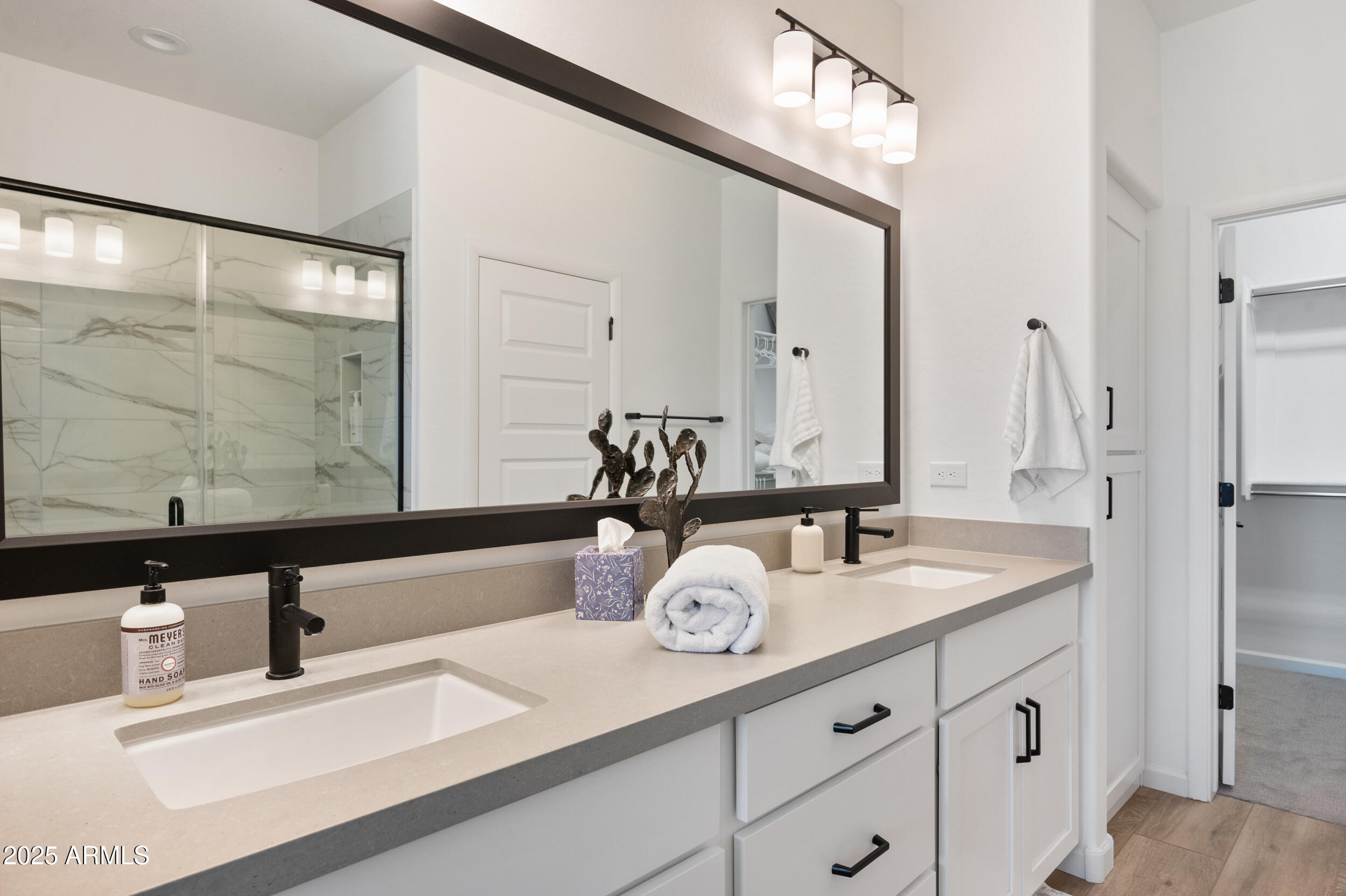 18328 East Spring Valley Court Rio Verde, AZ 85263 - Photo 18 of 39 a bathroom with a double vanity sink and a mirror