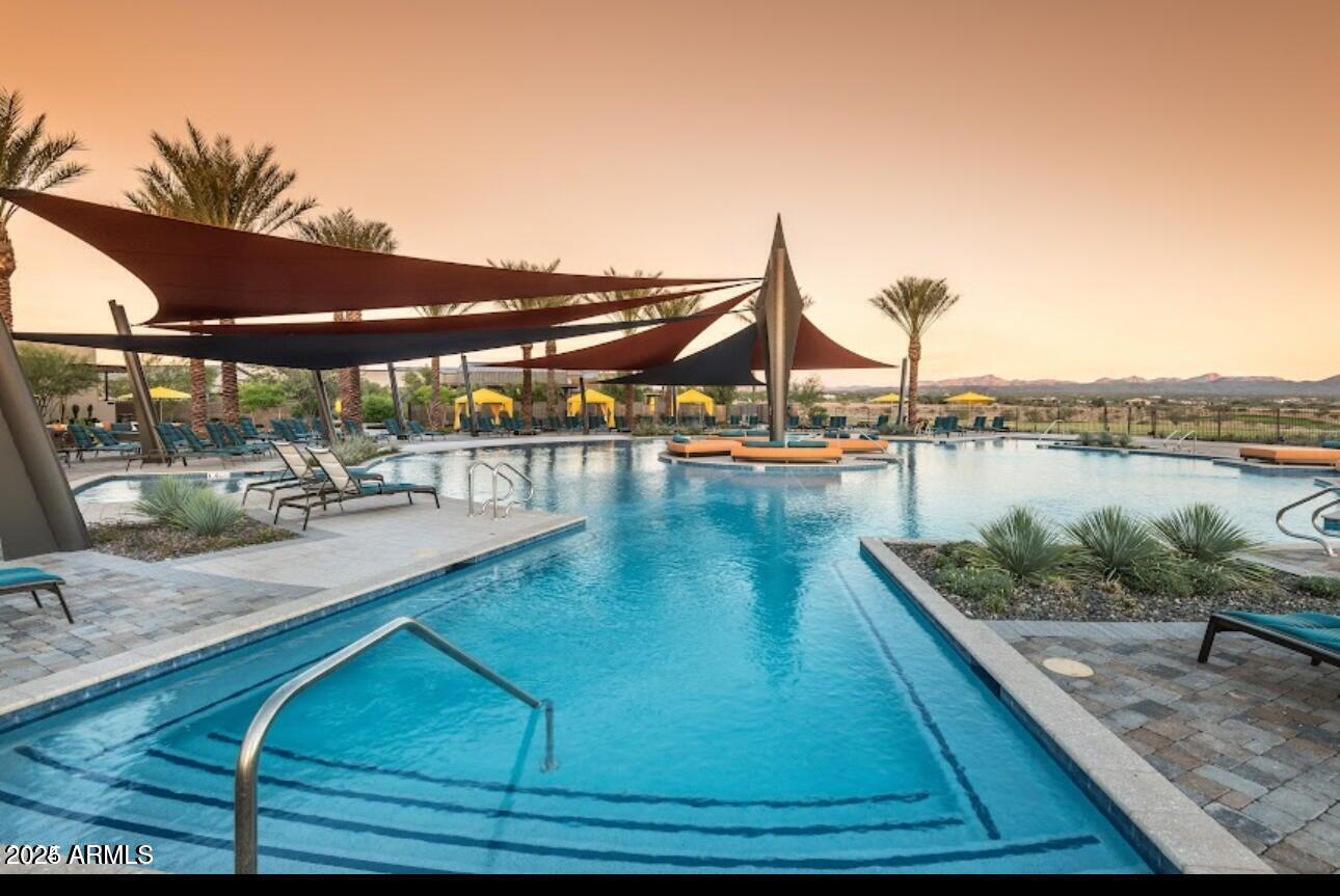 18328 East Spring Valley Court Rio Verde, AZ 85263 - Photo 32 of 39 a view of a swimming pool with lounge chair