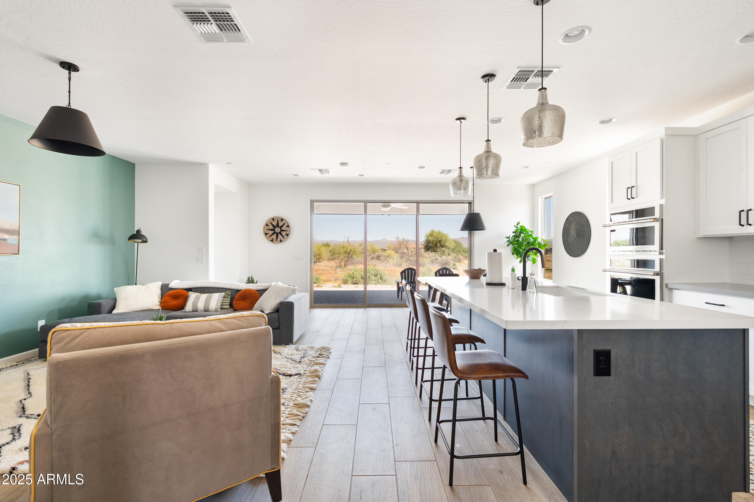 18328 East Spring Valley Court Rio Verde, AZ 85263 - Photo 5 of 39 a living room with furniture and a chandelier