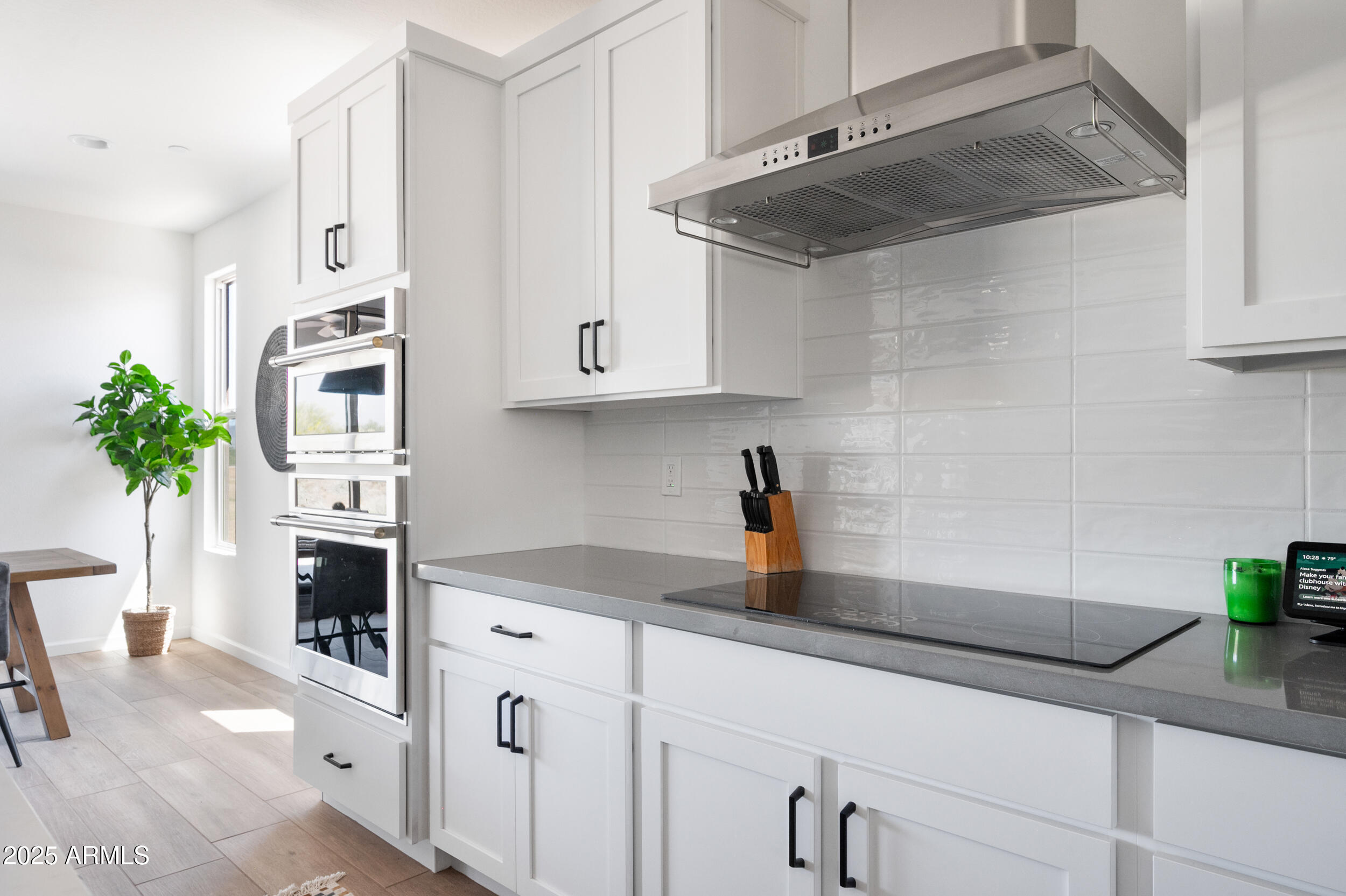 18328 East Spring Valley Court Rio Verde, AZ 85263 - Photo 7 of 39 a kitchen with stainless steel appliances a sink a stove and cabinets