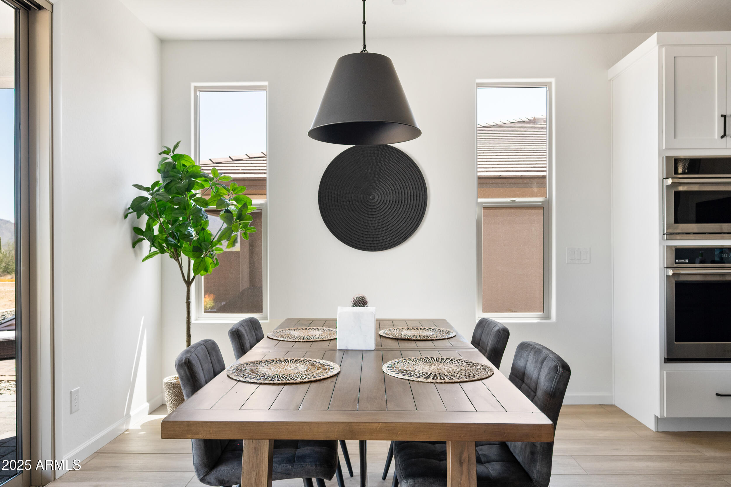 18328 East Spring Valley Court Rio Verde, AZ 85263 - Photo 8 of 39 a view of a dining room with furniture and wooden floor