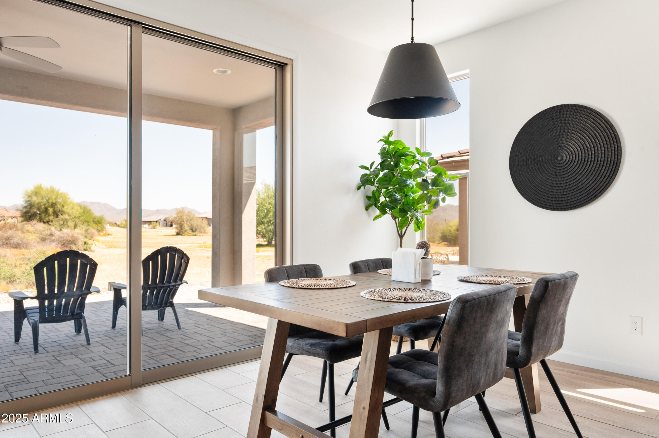 18328 East Spring Valley Court Rio Verde, AZ 85263 - Photo 9 of 39 a view of a dining room with furniture and wooden floor