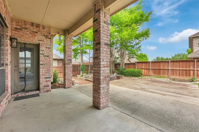 a view of a garden with a building in the background