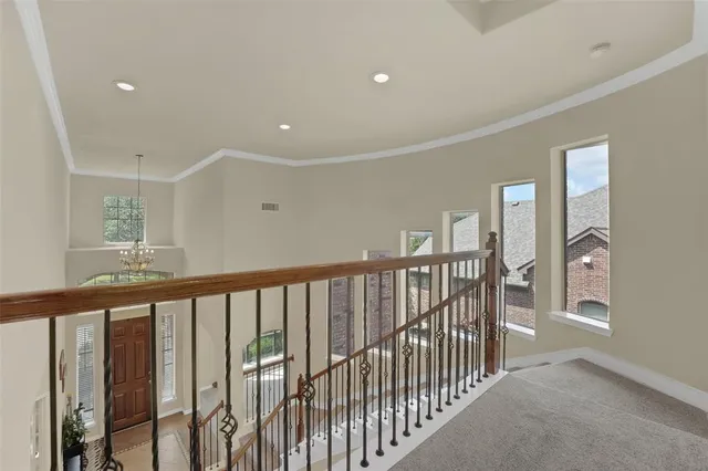 a view of a hallway with windows