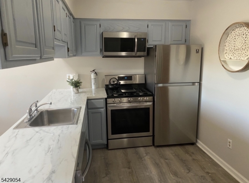 2 Acapulco Princess, Unit 4 Vernon, NJ 07462 - Photo 3 of 8 a kitchen with a refrigerator stove and microwave