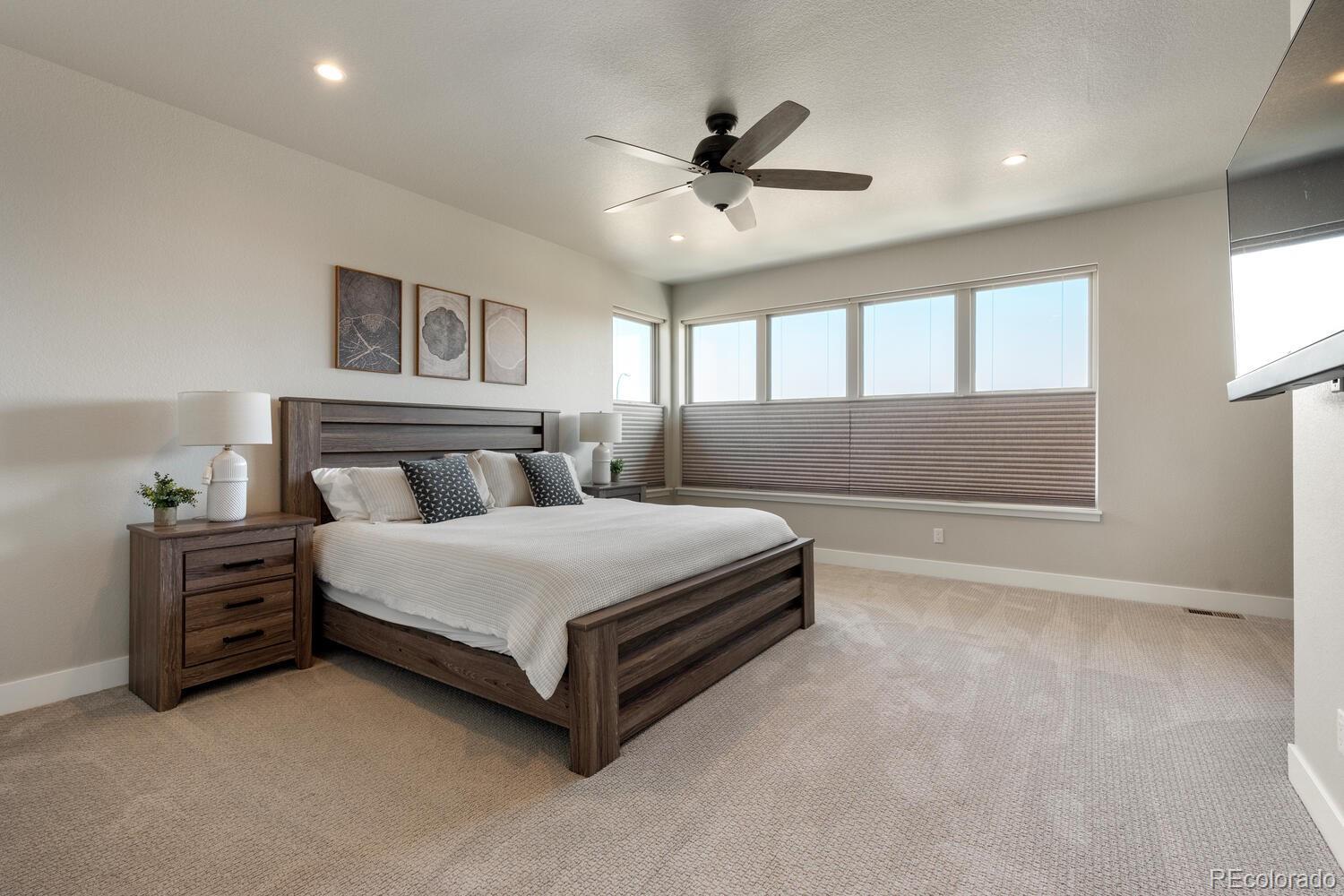 507 Red Thistle Drive Highlands Ranch, CO 80126 - Photo 14 of 42 a bedroom with a bed and window