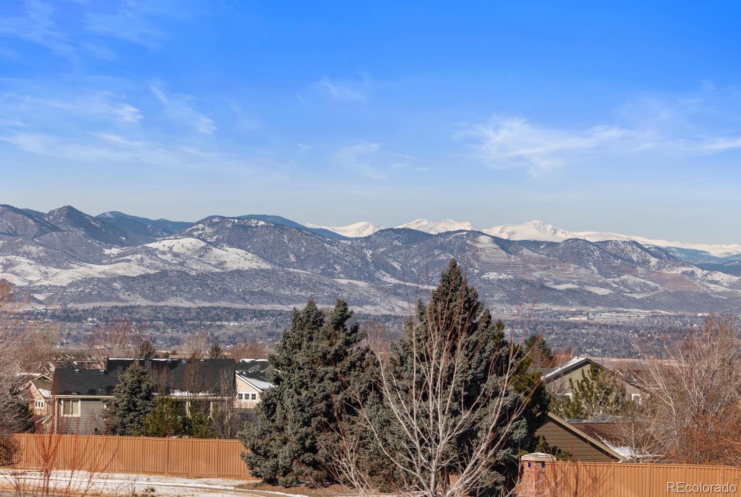 507 Red Thistle Drive Highlands Ranch, CO 80126 - Photo 18 of 42 a view of a city with mountains in the background