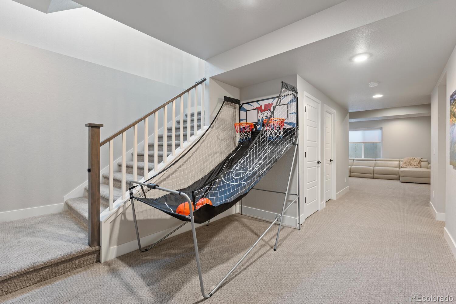 507 Red Thistle Drive Highlands Ranch, CO 80126 - Photo 27 of 42 a view of a hallway with staircase