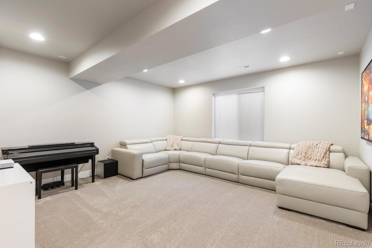 507 Red Thistle Drive Highlands Ranch, CO 80126 - Photo 29 of 42 a living room with furniture and a piano