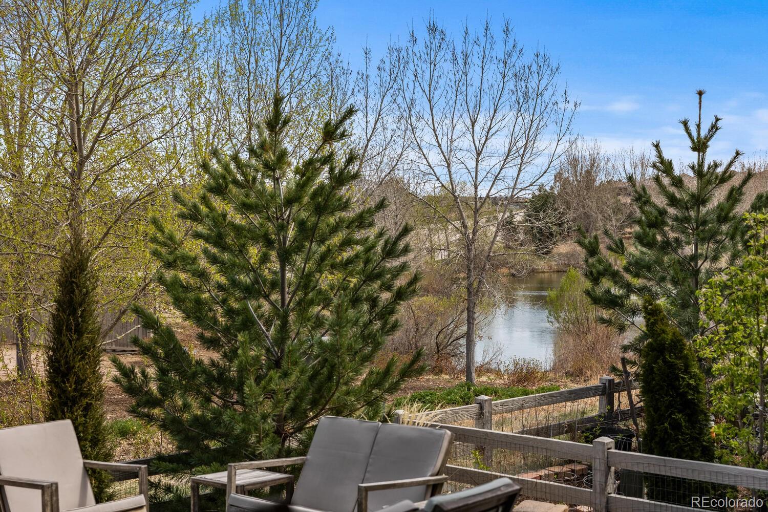 507 Red Thistle Drive Highlands Ranch, CO 80126 - Photo 36 of 42 a backyard of a house with table and chairs