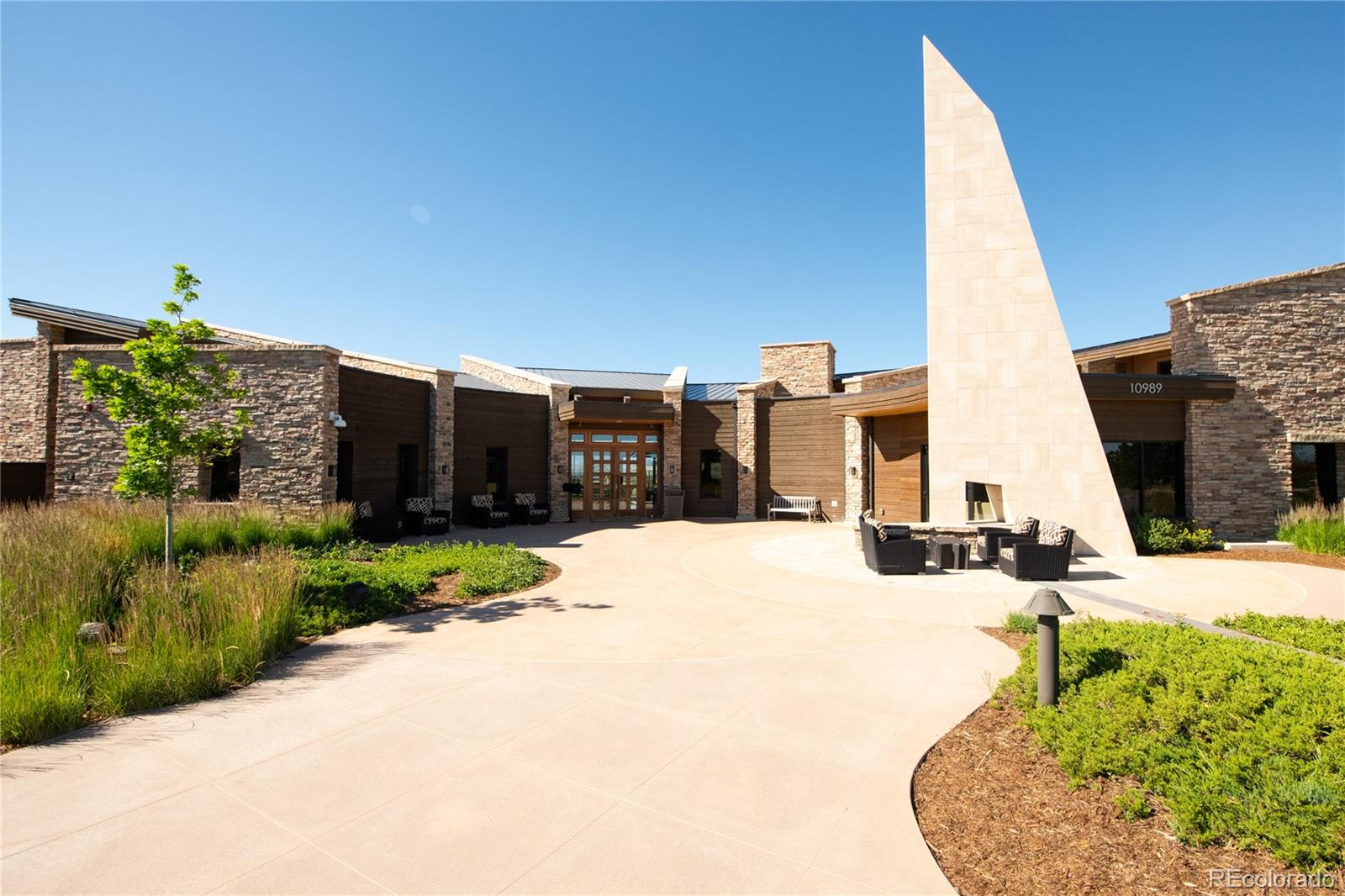 507 Red Thistle Drive Highlands Ranch, CO 80126 - Photo 40 of 42 a view of a building with a yard