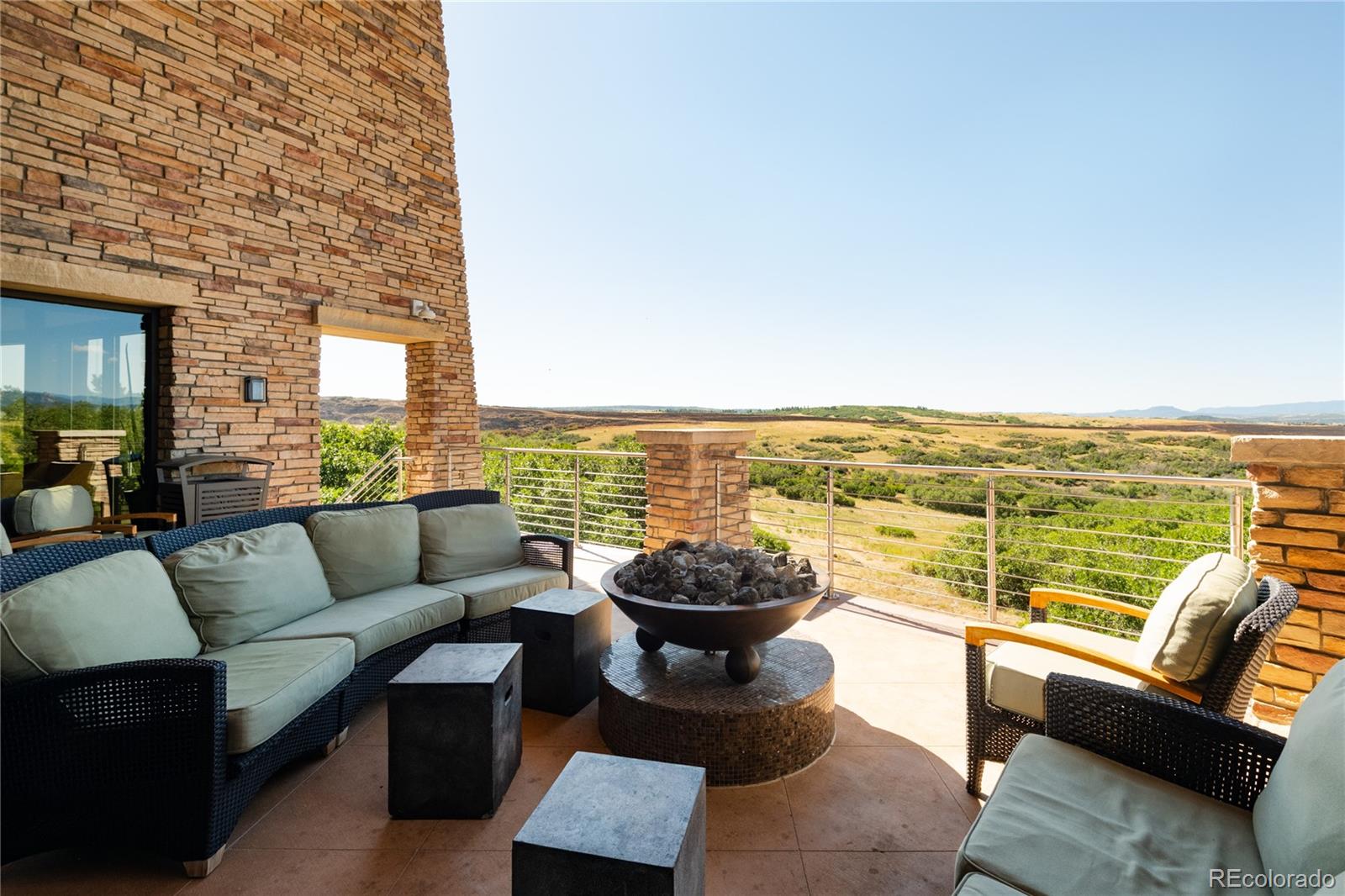 507 Red Thistle Drive Highlands Ranch, CO 80126 - Photo 41 of 42 a view of a patio with couches and ocean view
