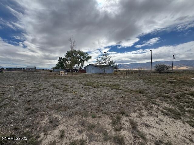 1600 Kyle Hot Springs Road Imlay, NV 89418 - Photo 25 of 45 a view of a dry yard with wooden fence