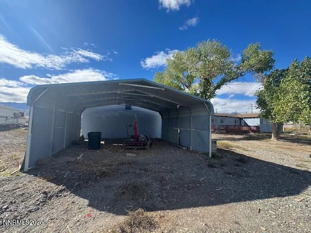 a view of backyard and trees
