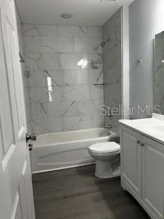 a bathroom with a toilet sink and bathtub