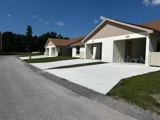 a front view of a house with yard