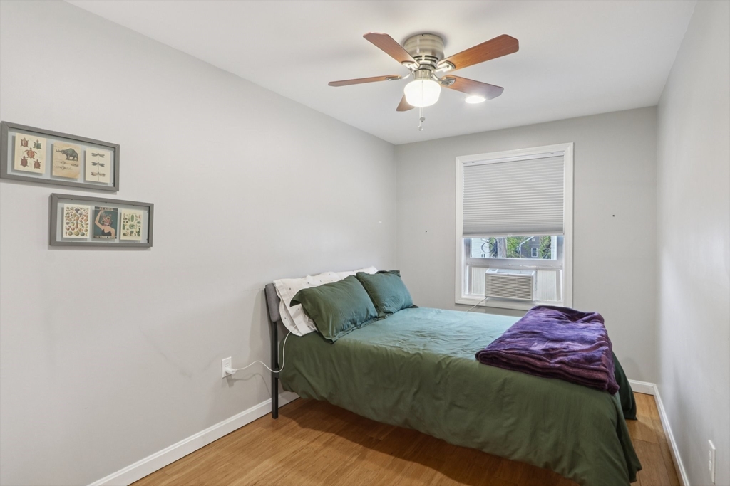 19 Delford Street, Unit 1 Boston, MA 02131 - Photo 15 of 25 a bedroom with a bed and a window