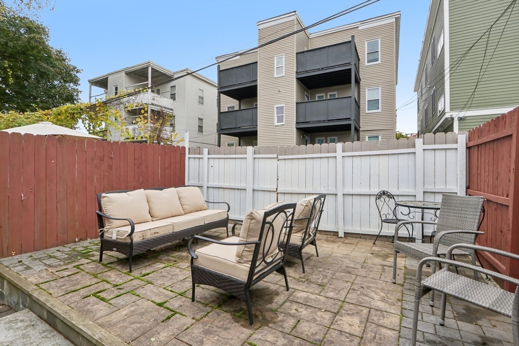 19 Delford Street, Unit 1 Boston, MA 02131 - Photo 21 of 25 a view of a patio with couple of chairs