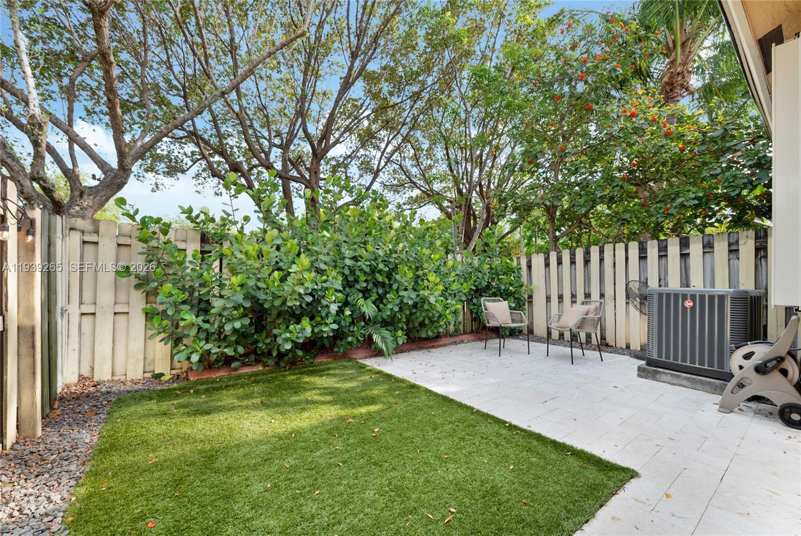 12480 Southwest 125th Terrace Miami, FL 33186 - Photo 18 of 19 a view of a chair and bench in the garden