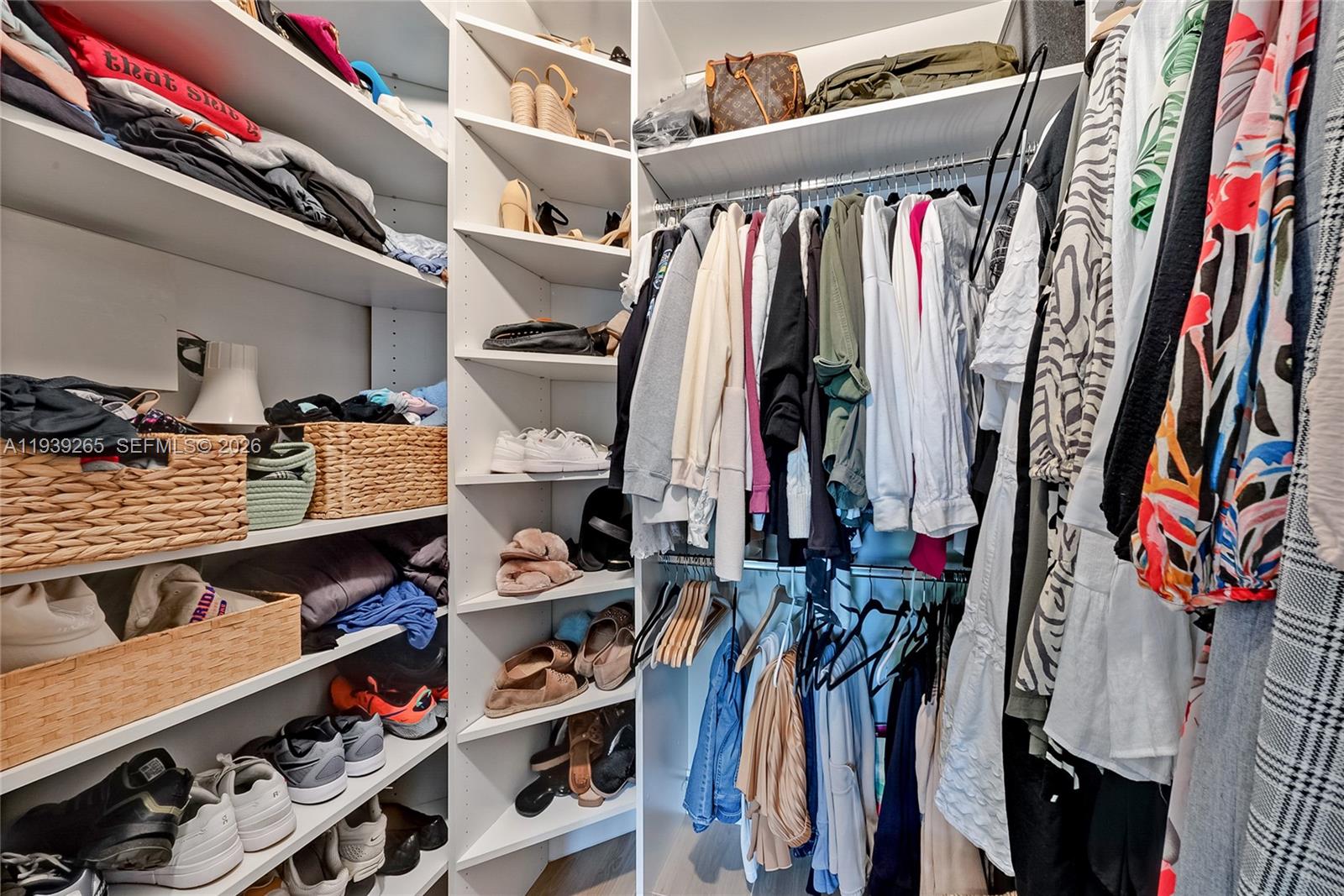 12480 Southwest 125th Terrace Miami, FL 33186 - Photo 10 of 19 a view of walk in closet with clothes and shoes