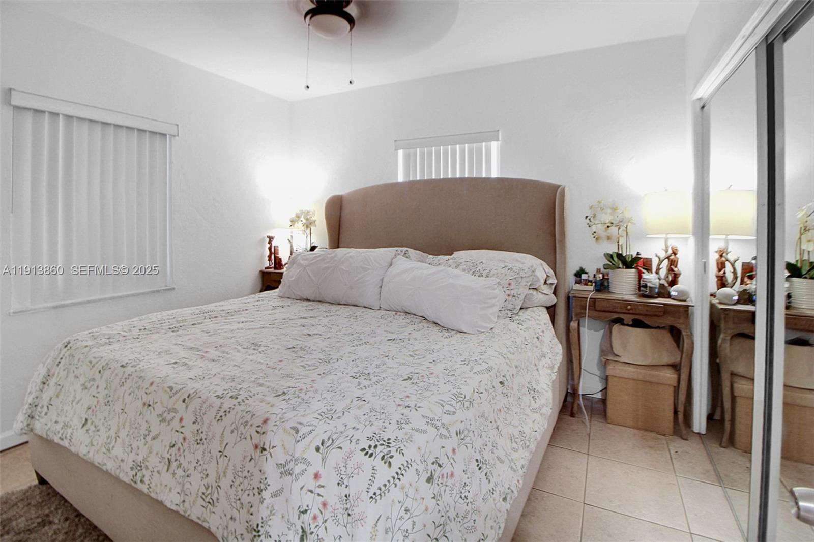 3462 Southwest 27th Street Miami, FL 33133 - Photo 13 of 17 a bedroom with a bed and a window