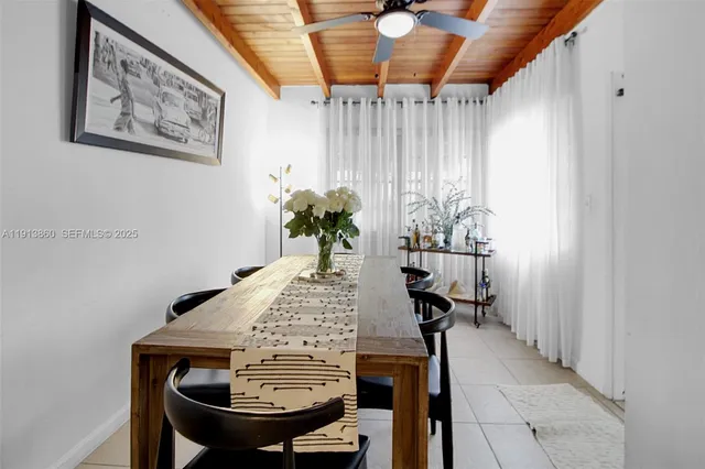 a view of a dining room with furniture and window