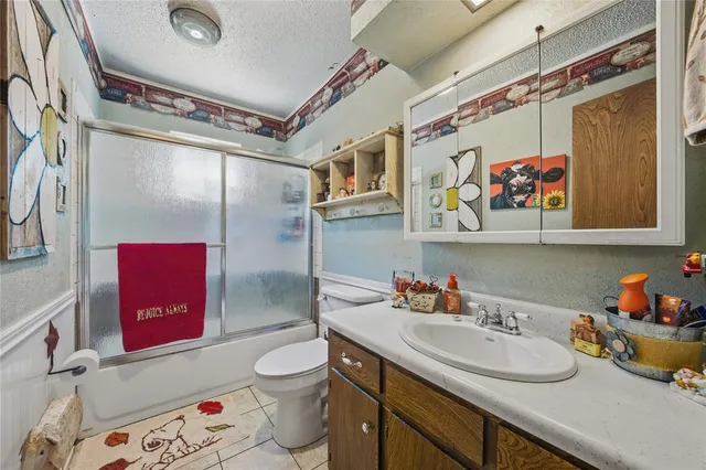 a bathroom with a sink a vanity and a mirror