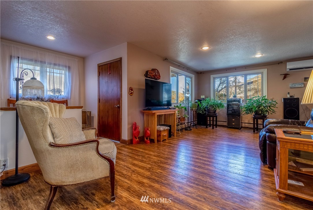 142 Barger Road Prescott, WA 99348 - Photo 3 of 40 a living room with furniture and a flat screen tv
