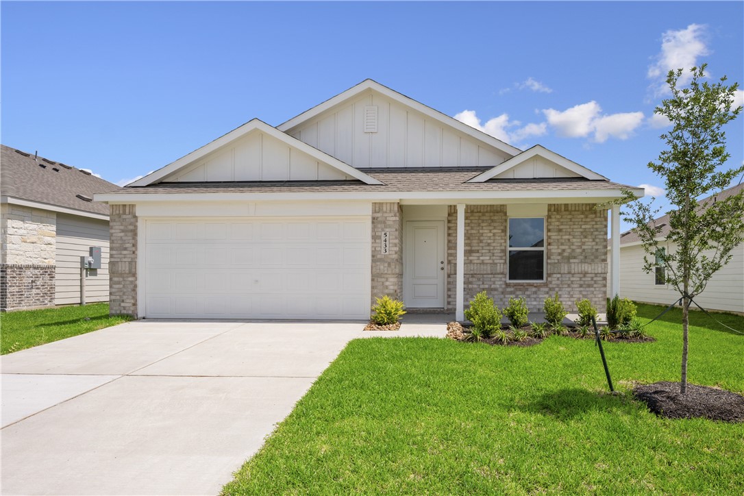 5433 Bear Run Bryan, TX 77807 - Photo 1 of 23 a front view of a house with a garden and plants
