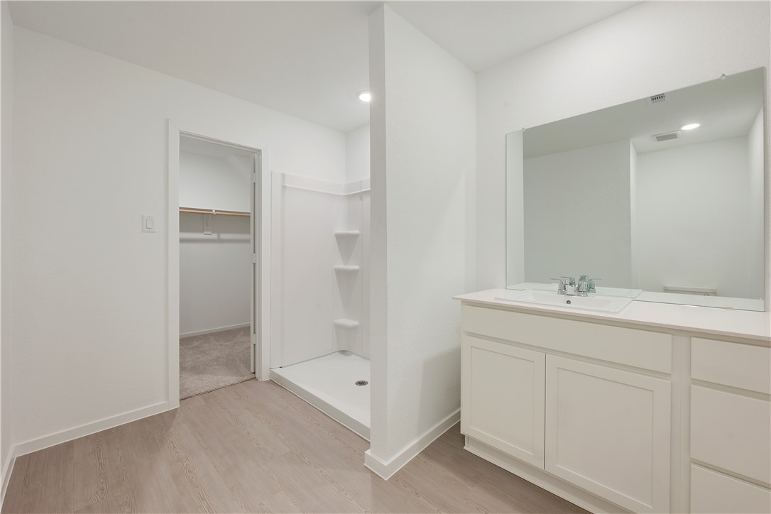 5433 Bear Run Bryan, TX 77807 - Photo 15 of 23 a bathroom with a sink and a mirror