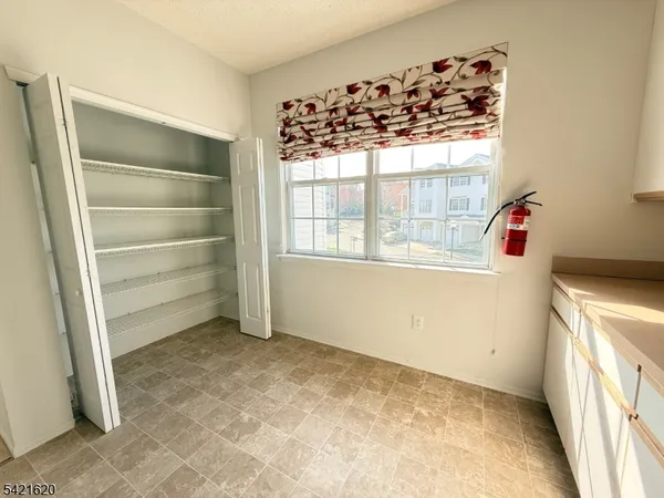 a bathroom with a granite countertop sink a toilet and bathtub