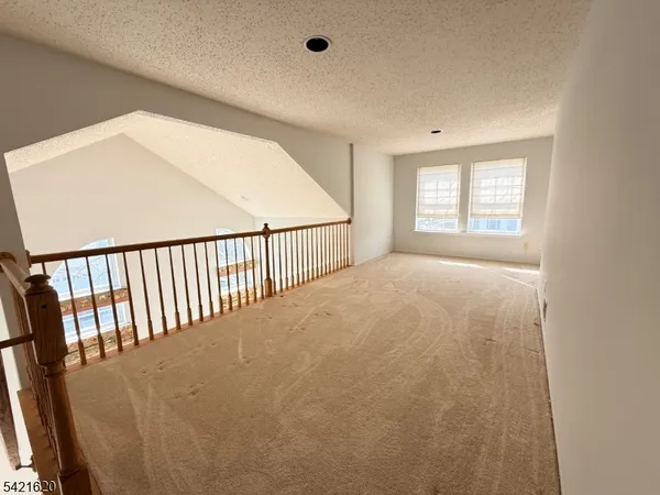 a bathroom with a granite countertop sink a mirror and a shower