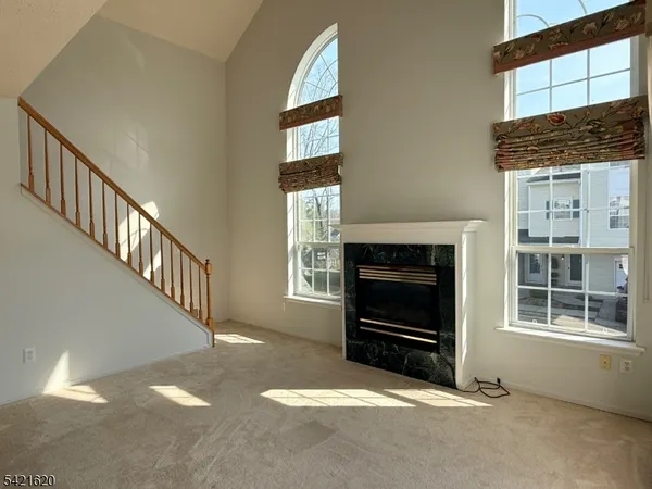 a view of a chandelier in big room and chandelier