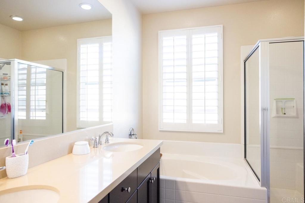 2332 Sentinel Lane San Marcos, CA 92078 - Photo 13 of 24 a bathroom with a granite countertop sink and a bathtub