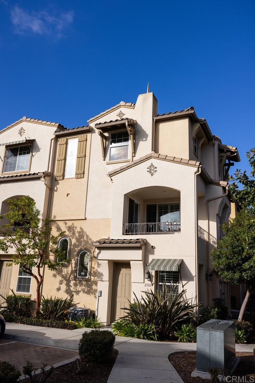 2332 Sentinel Lane San Marcos, CA 92078 - Photo 2 of 24 a view of a white building with many windows