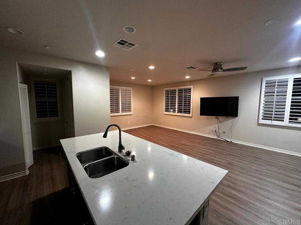 2332 Sentinel Lane San Marcos, CA 92078 - Photo 23 of 24 a kitchen with stainless steel appliances a sink table and chairs