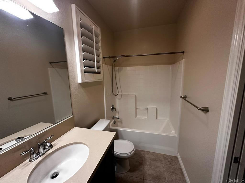 2332 Sentinel Lane San Marcos, CA 92078 - Photo 24 of 24 a bathroom with a sink toilet and shower