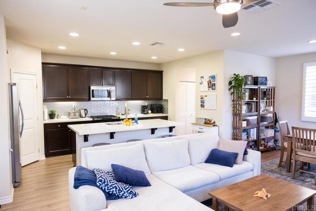 2332 Sentinel Lane San Marcos, CA 92078 - Photo 3 of 24 a living room with stainless steel appliances furniture and a kitchen view