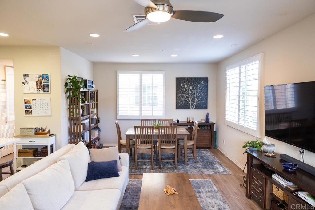 2332 Sentinel Lane San Marcos, CA 92078 - Photo 9 of 24 a living room with furniture a flat screen tv and a large window